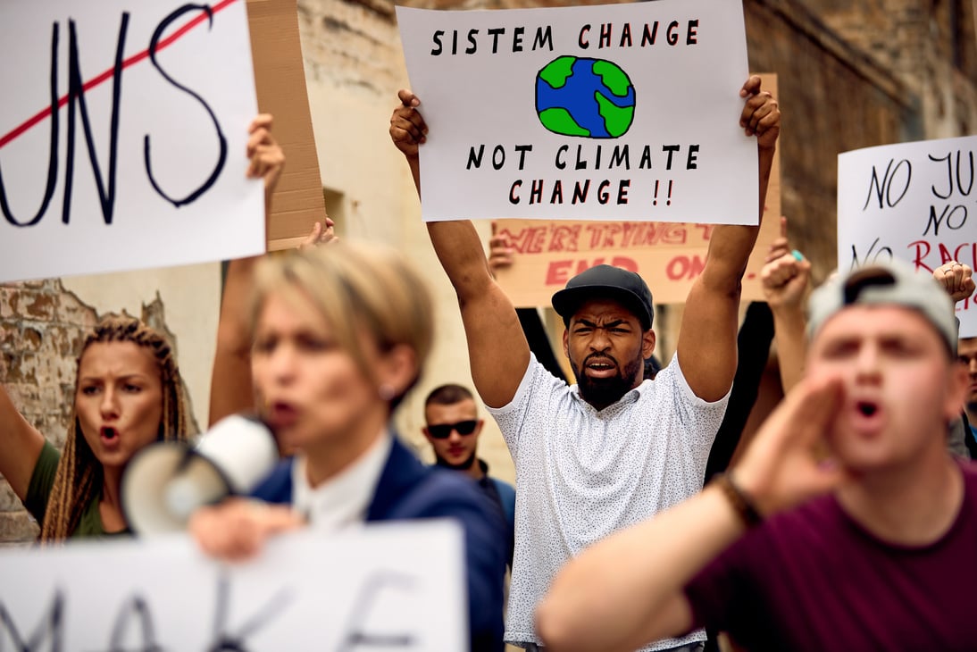 Group of activists demonstrating against racial inequality on city streets.